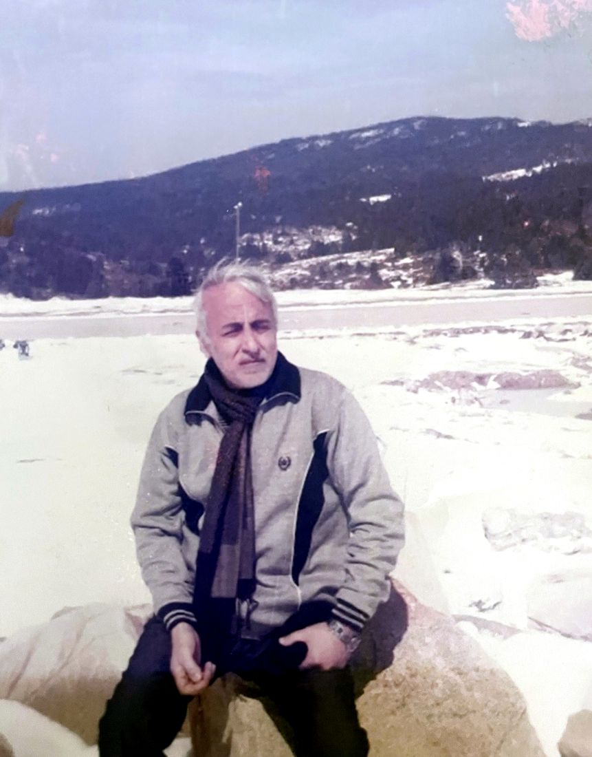 Mohammed Mokhles Murad, our founder, sitting outdoors in winter