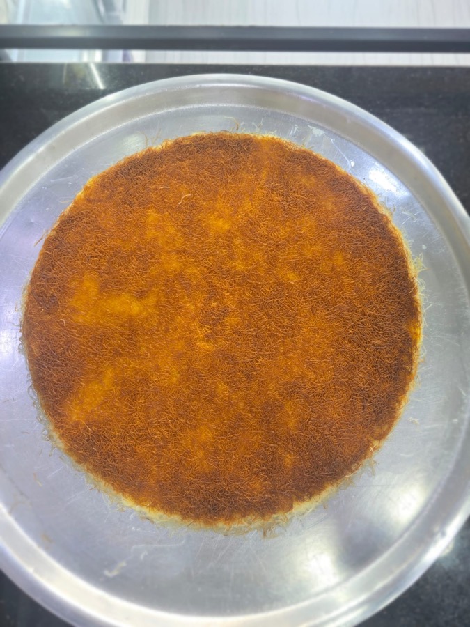 A real golden khishneh tray just after the flip